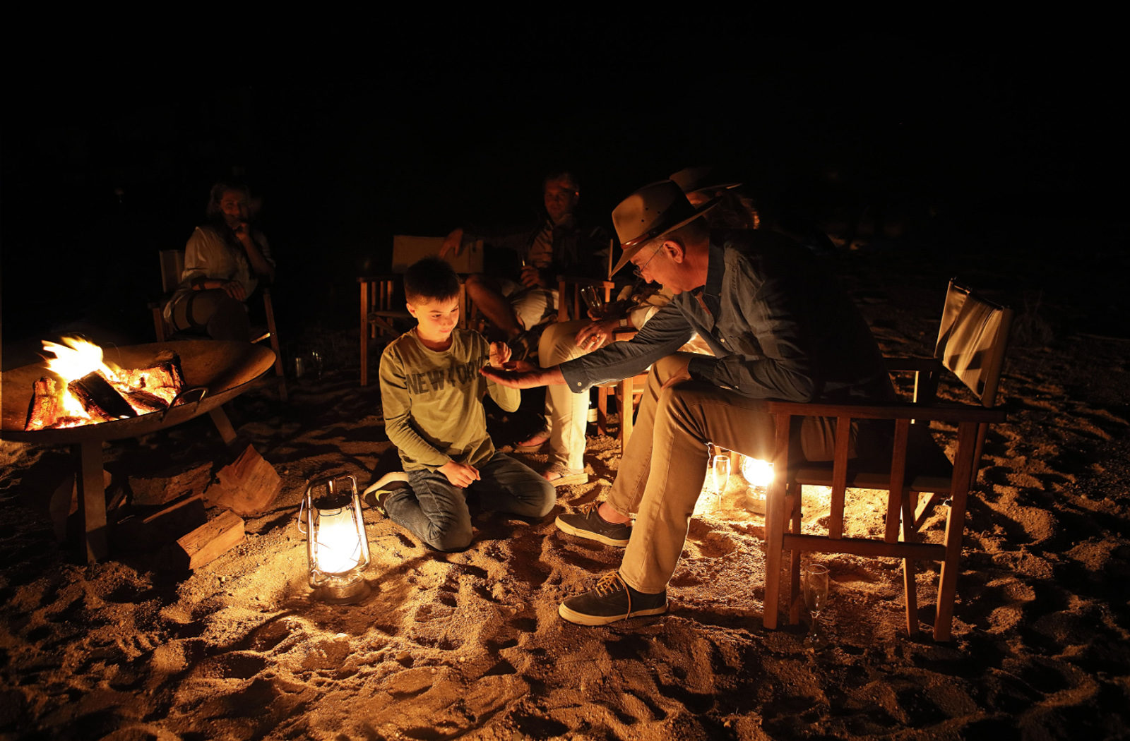 Storytelling around the campfire, Londolozi, South Africa